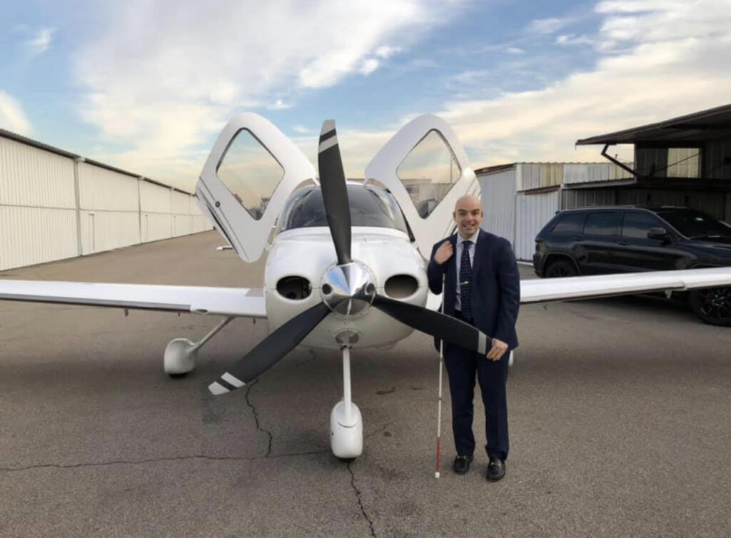 Gian in front of a plane